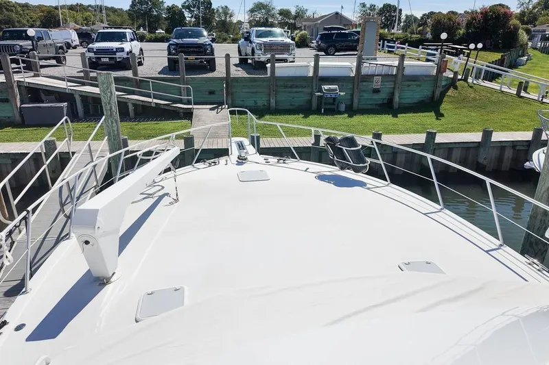 Slide: The Image of 1999 Viking Cockpit Sports Yacht interior with helm, steering wheel, and navigation controls. - 26