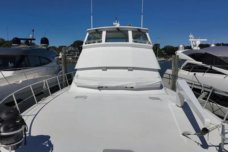 Slide: The Image of Cockpit of a 1999 Viking Sports Yacht with steering wheel and navigation controls. - 27