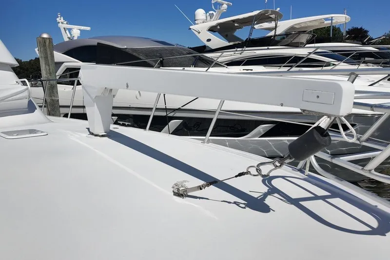 Slide: The Image of Control panel of a 1999 Viking Cockpit Sports Yacht with steering wheel and throttle levers. - 28