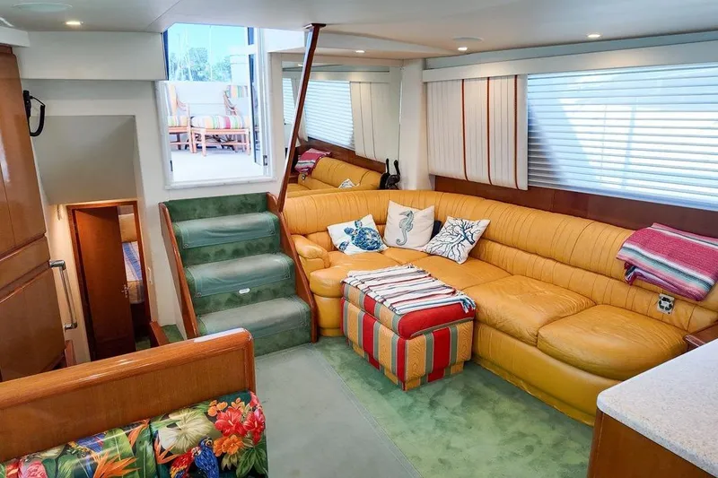 Slide: The Image of 1999 Viking Cockpit Sports Yacht docked in urban marina setting. - 3