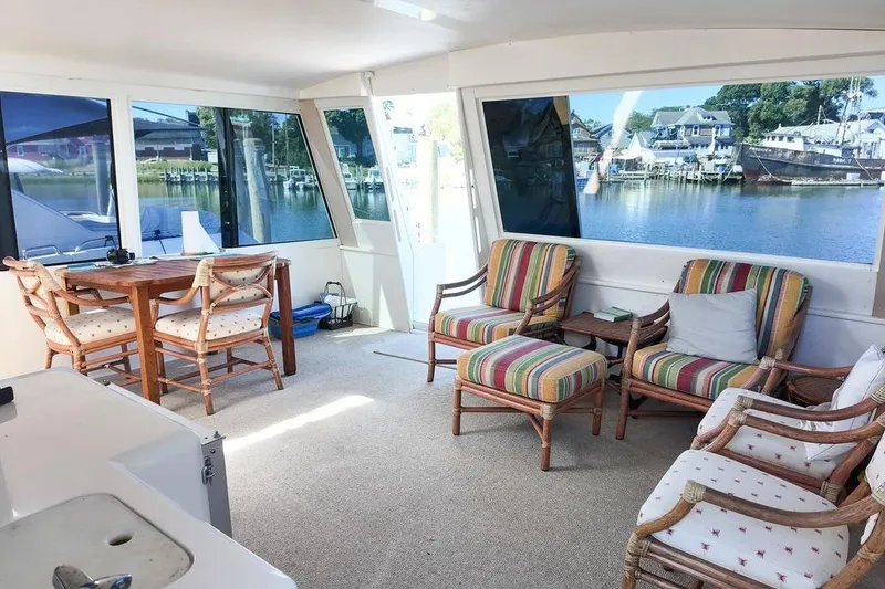 Slide: The Image of 1999 Viking Cockpit Sports Yacht with open sliding doors and white exterior. - 30