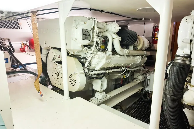 Slide: The Image of 1999 Viking Cockpit Sports Yacht interior with colorful seating and waterfront view. - 36