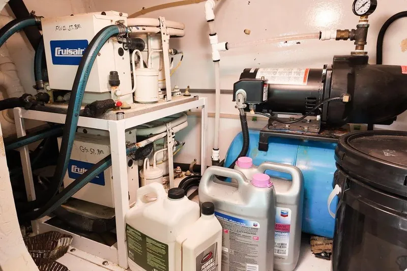 Slide: The Image of Interior of 1999 Viking Cockpit Sports Yacht with seating, table, and TV. - 37