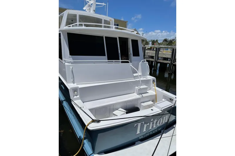 Slide: The Image of Engine room of a 1999 Viking Cockpit Sports Yacht with mechanical equipment and supplies. - 45