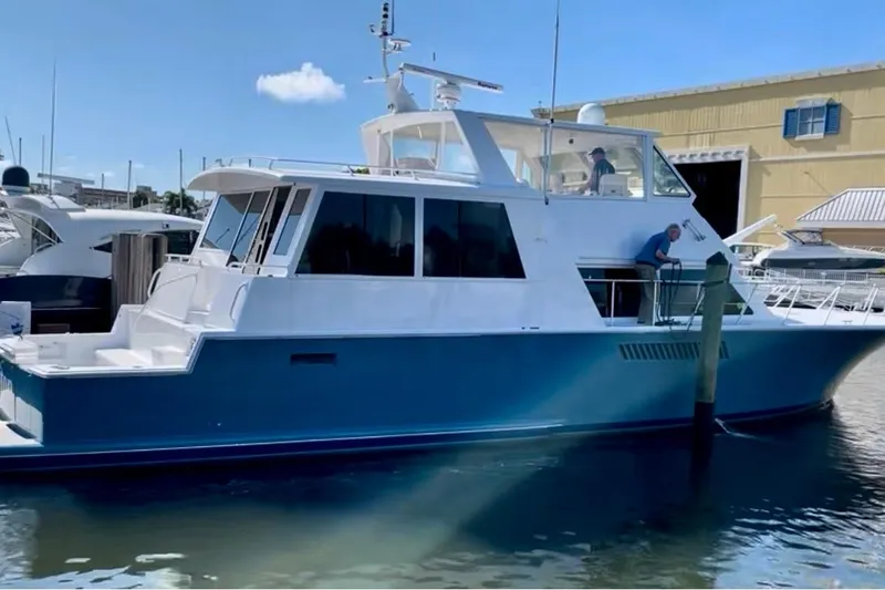 Slide: The Image of Engine room of a 1999 Viking Cockpit Sports Yacht with Cruisair systems and storage containers. - 46