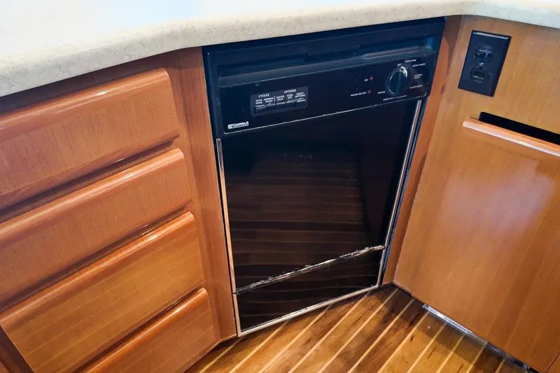 Slide: The Image of Luxurious interior of a 1999 Viking Cockpit Sports Yacht with plush seating and modern decor. - 6