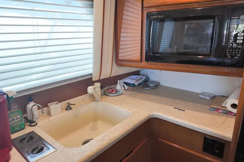 Slide: The Image of Luxurious interior of a 1999 Viking Cockpit Sports Yacht with cozy seating and elegant decor. - 7