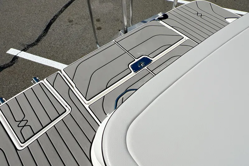 Slide: The Image of 2026 Sea Ray SPX 210 boat deck with sleek, modern design and textured flooring. - 8