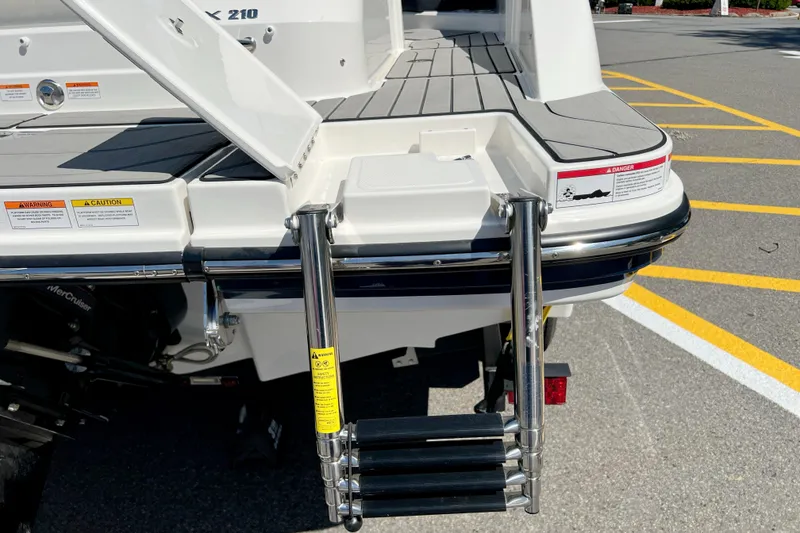 Slide: The Image of 2026 Sea Ray SPX 210 boat with swim platform and retractable ladder. - 9