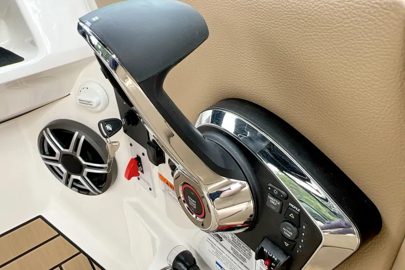 Slide: The Image of 2026 Sea Ray SDX 230 boat throttle control and speaker detail. - 11