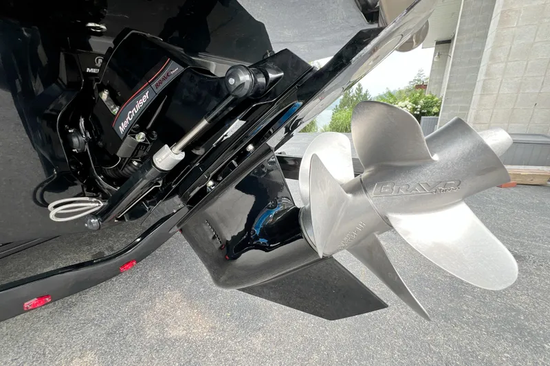 Slide: The Image of Close-up of 2026 Sea Ray SDX 230 boat's MerCruiser Bravo Three propeller system. - 3
