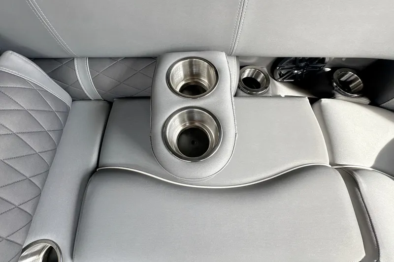 Slide: The Image of Luxury seating with cup holders in 2026 Bennington 24 LSB boat interior. - 15