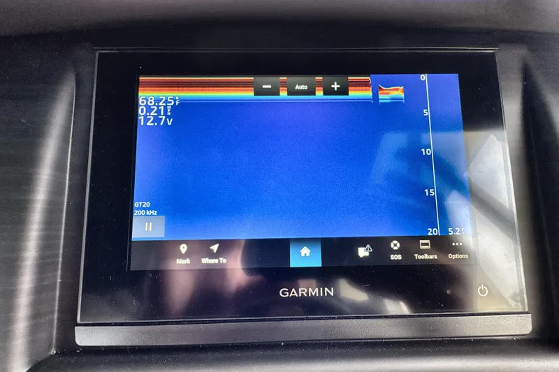 Slide: The Image of Garmin display on 2026 Bennington 24 LSB showing sonar and temperature data. - 2
