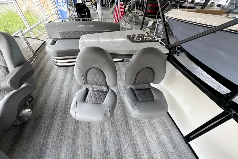Slide: The Image of 2026 Bennington 24 LSB boat interior with gray seating and modern design. - 8