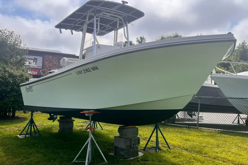 Slide: The Image of 2016 Parker 2100 Special Edition boat on stands, displayed outdoors. - 7