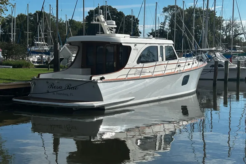 The Image of 2026 Vicem 55 Classic yacht docked in a serene marina setting. - 1
