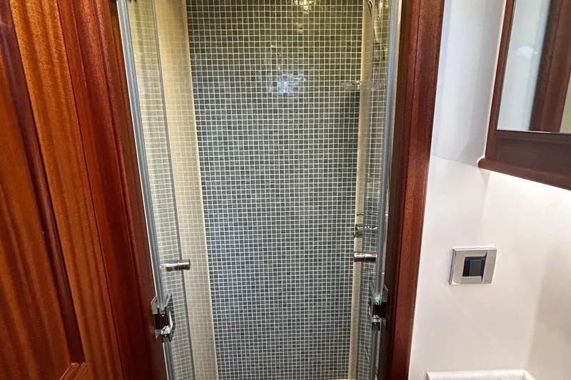 Slide: The Image of Shower area in 2026 Vicem 55 Classic yacht with glass door and mosaic tiles. - 12