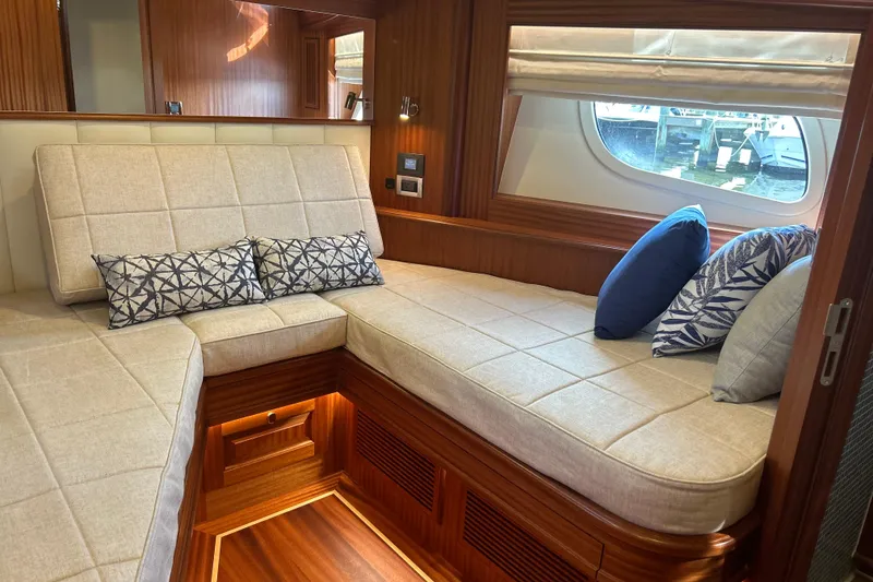 Slide: The Image of Luxurious interior of 2026 Vicem 55 Classic yacht with elegant seating and decorative cushions. - 13
