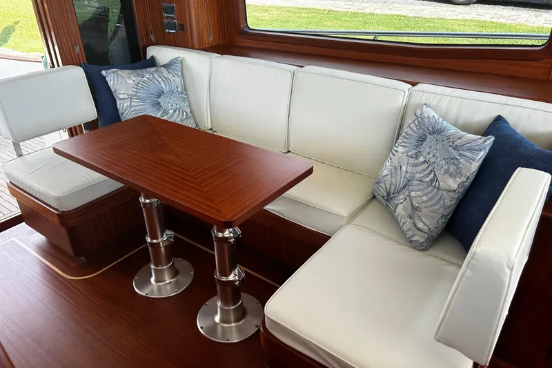 Slide: The Image of Luxurious interior of 2026 Vicem 55 Classic yacht with elegant seating and wooden table. - 3