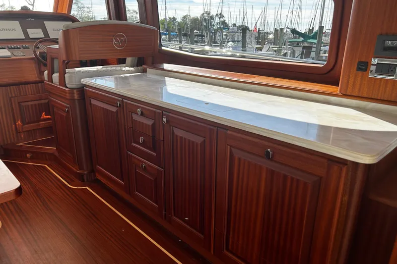 Slide: The Image of Luxurious interior of 2026 Vicem 55 Classic yacht with elegant wood cabinetry and marble countertop. - 7