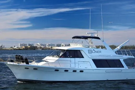 Slide: The Image of 1998 Bayliner 4788 Pilot House Motoryacht cruising on a sunny day. - 1