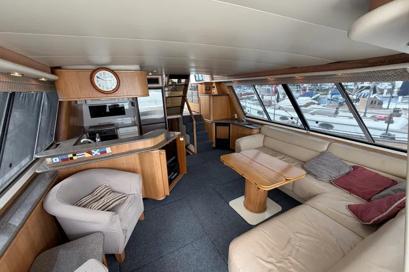 Slide: The Image of Interior of 1998 Bayliner 4788 Pilot House Motoryacht with cozy seating and modern amenities. - 11