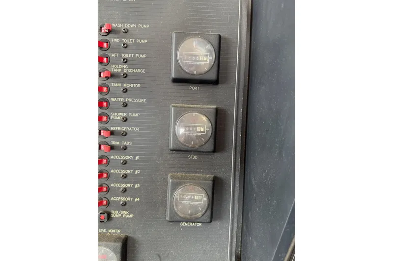 Slide: The Image of Control panel of a 1998 Bayliner 4788 Pilot House Motoryacht with gauges and switches. - 34
