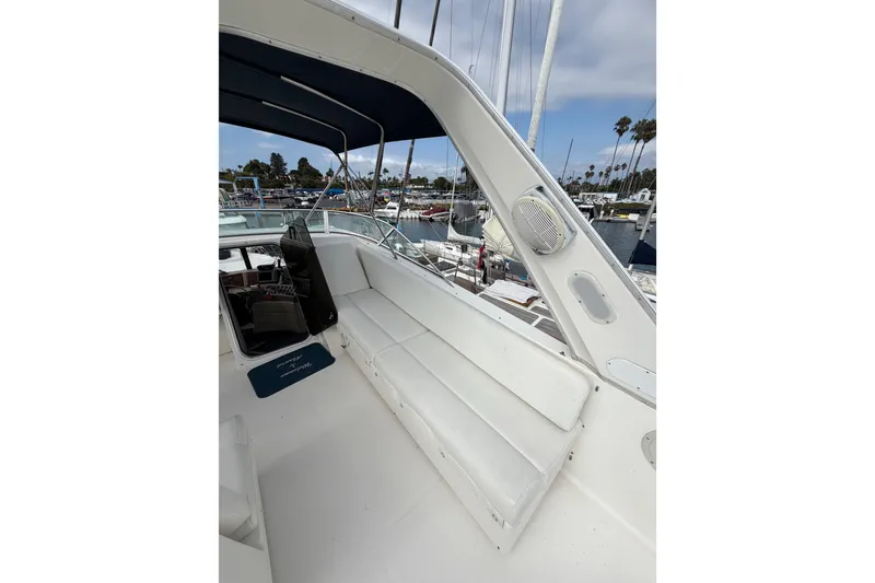 Slide: The Image of 1998 Bayliner 4788 Pilot House Motoryacht interior with seating and marina view. - 43
