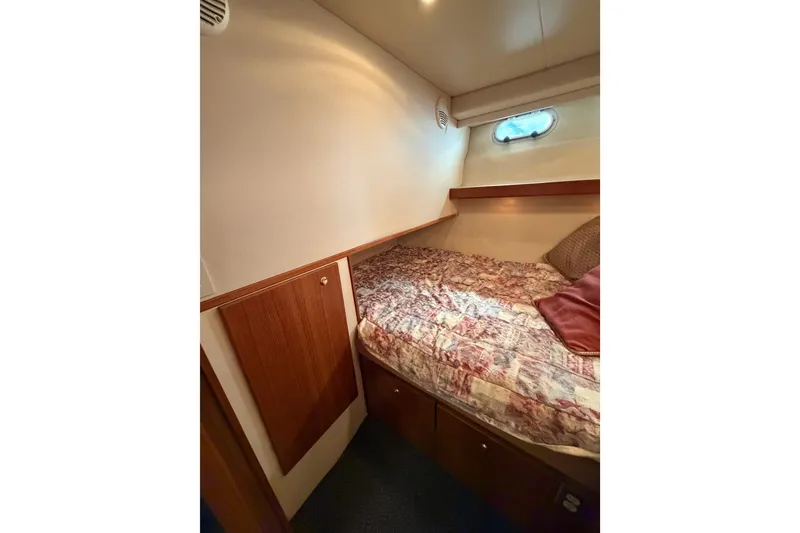 Slide: The Image of Cozy cabin interior of 1998 Bayliner 4788 Pilot House Motoryacht with bed and window. - 55