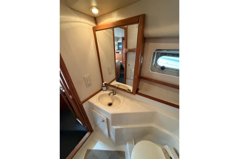 Slide: The Image of Bathroom interior of 1998 Bayliner 4788 Pilot House Motoryacht with sink and mirror. - 65