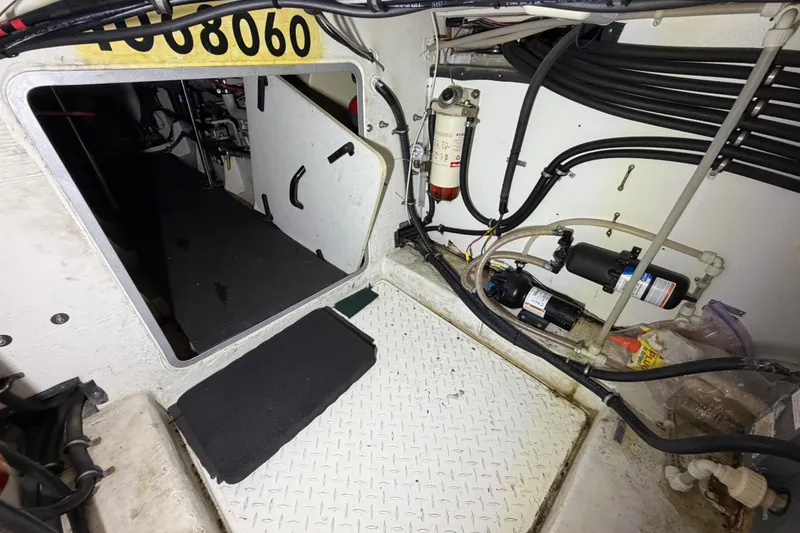 Slide: The Image of Engine room of 1998 Bayliner 4788 Pilot House Motoryacht with visible wiring and equipment. - 71