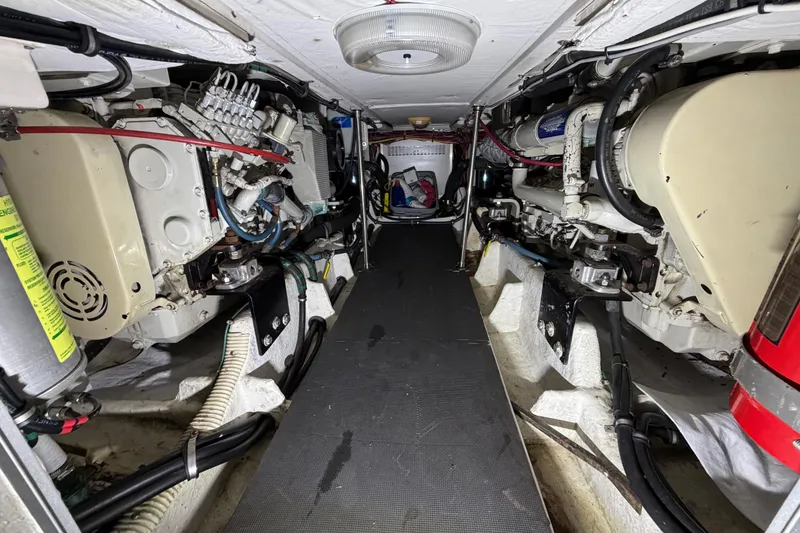 Slide: The Image of Engine room of 1998 Bayliner 4788 Pilot House Motoryacht, showcasing mechanical components and systems. - 72