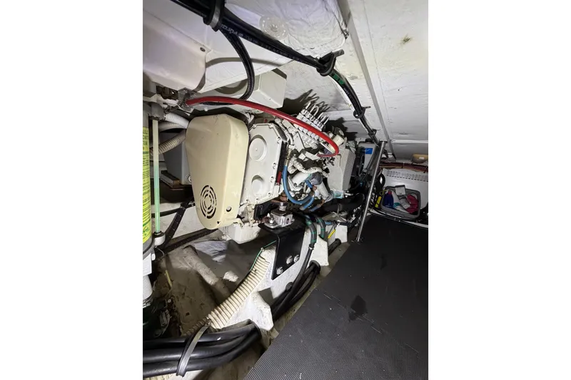 Slide: The Image of Engine room of 1998 Bayliner 4788 Pilot House Motoryacht, showcasing mechanical components. - 73