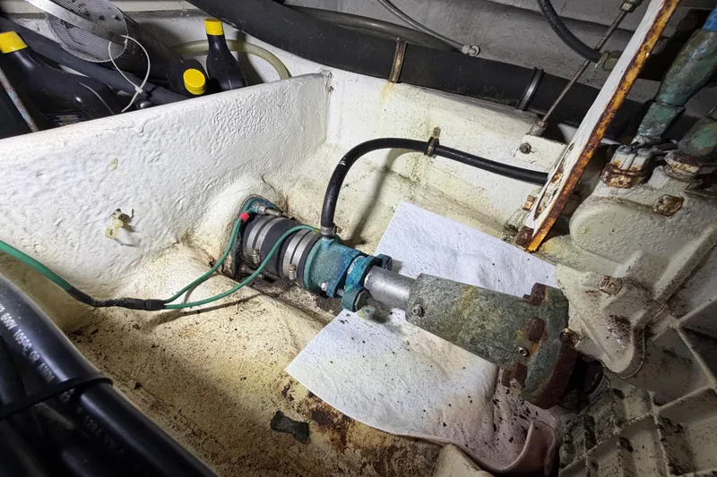 Slide: The Image of Engine compartment of a 1998 Bayliner 4788 Pilot House Motoryacht, showing mechanical components. - 75