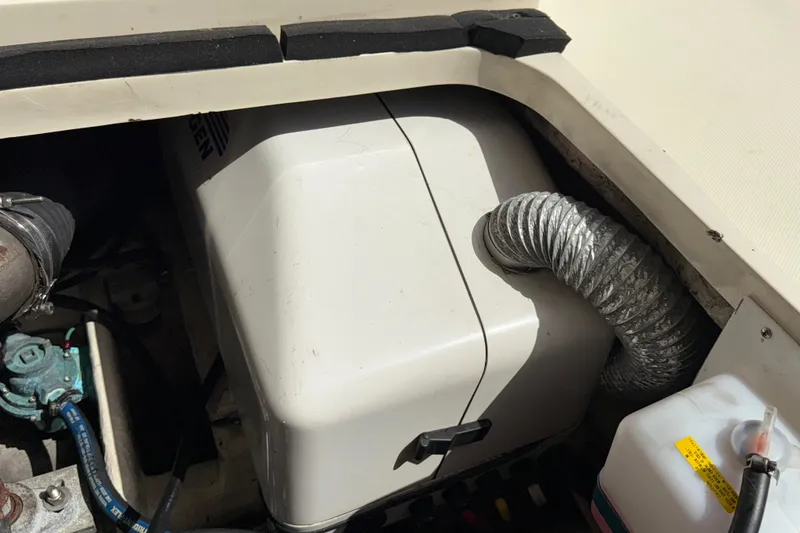 Slide: The Image of Engine compartment of a 2007 Mainship Pilot 30 Sedan boat, showing ventilation and components. - 21