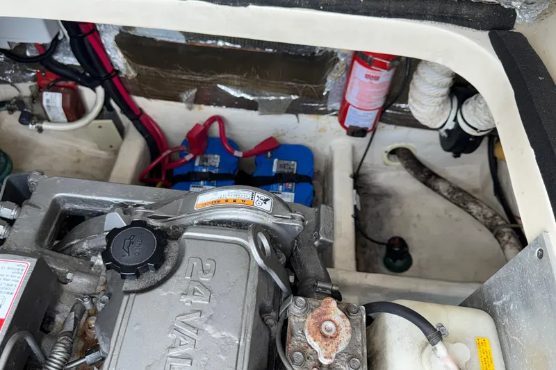 Slide: The Image of Engine compartment of a 2007 Mainship Pilot 30 Sedan with visible components and wiring. - 22