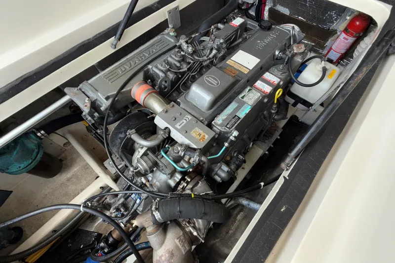 Slide: The Image of Engine compartment of a 2007 Mainship Pilot 30 Sedan boat, featuring a diesel engine. - 23