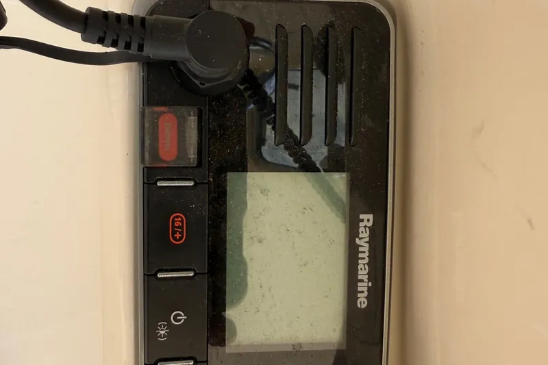 Slide: The Image of Raymarine marine device on 2007 Mainship Pilot 30 Sedan boat dashboard. - 26