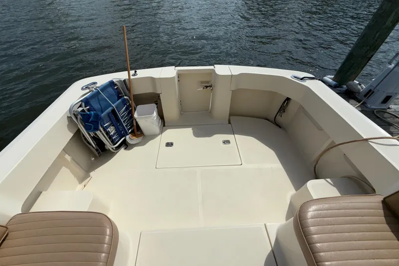 Slide: The Image of 2007 Mainship Pilot 30 Sedan boat deck with seating and storage. - 6