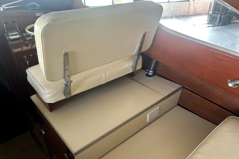 Slide: The Image of 1962 Prowler Forest Johnson boat interior with beige seating and wooden accents. - 23