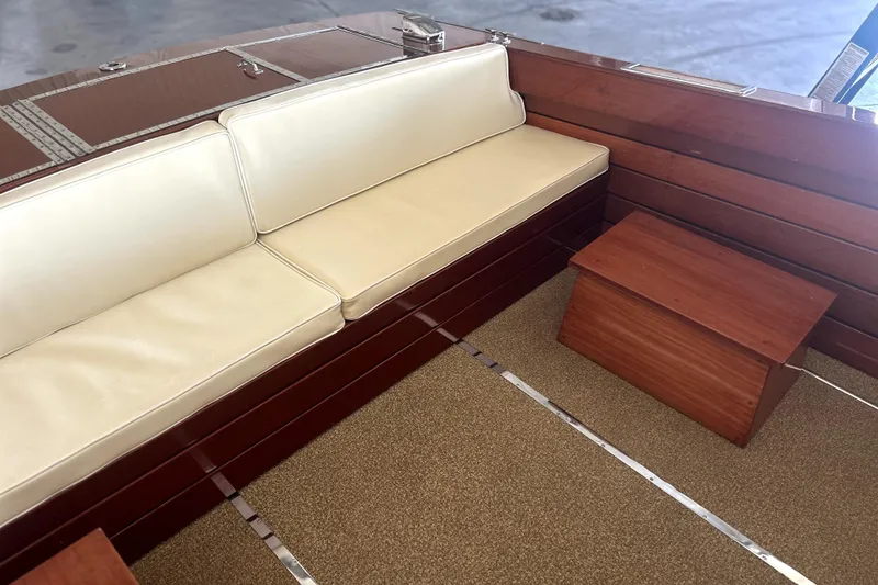 Slide: The Image of 1962 Prowler Forest Johnson boat interior with cream seating and wooden accents. - 27