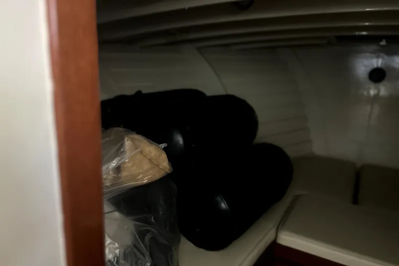 Slide: The Image of Interior of a 1962 Prowler Forest Johnson boat with storage area and cushions. - 32