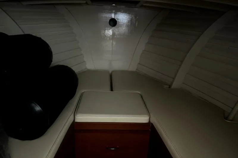 Slide: The Image of Interior cabin of a 1962 Prowler Forest Johnson boat, featuring cushioned seating. - 33