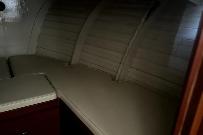 Slide: The Image of Interior cabin of a 1962 Prowler Forest Johnson boat with cushioned seating. - 34