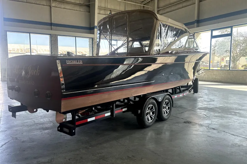 Slide: The Image of 1962 Prowler Forest Johnson boat on trailer in indoor setting. - 4