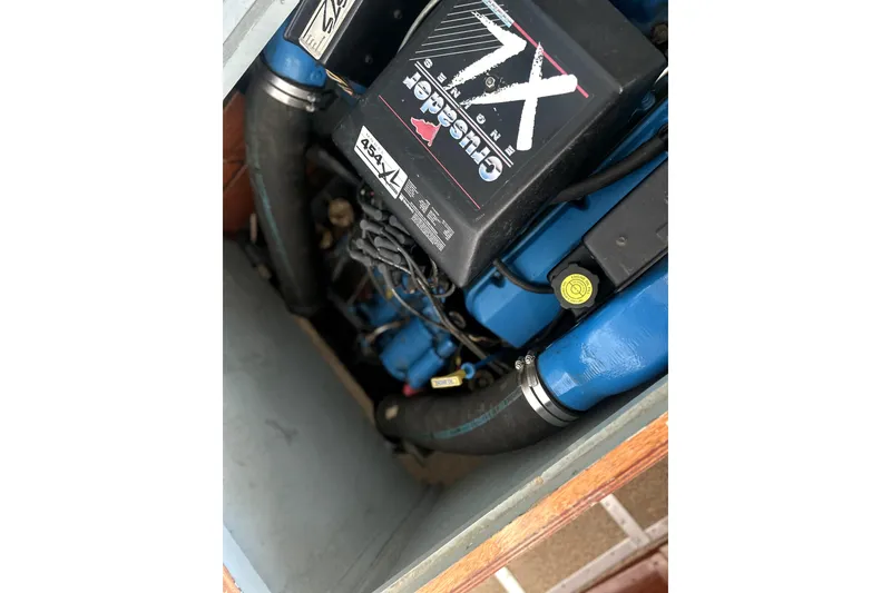 Slide: The Image of Close-up of a 1962 Prowler Forest Johnson engine with visible components and labels. - 42