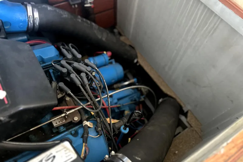 Slide: The Image of 1962 Prowler Forest Johnson engine compartment with visible wiring and hoses. - 45