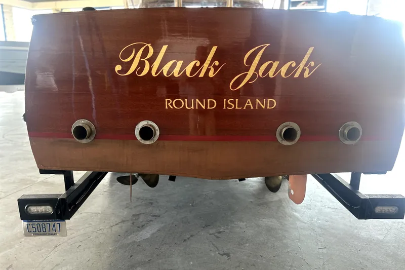 Slide: The Image of 1962 Prowler Forest Johnson boat, "Black Jack," with Round Island lettering and trailer. - 7