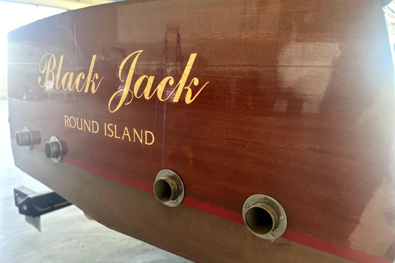 Slide: The Image of 1962 Prowler Forest Johnson boat with "Black Jack" and "Round Island" on wooden stern. - 8