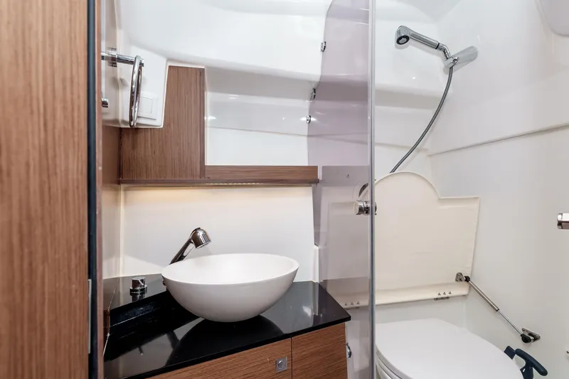 Slide: The Image of Modern bathroom interior of 2023 Jeanneau Leader 9.0 WA boat, featuring sleek design elements. - 21